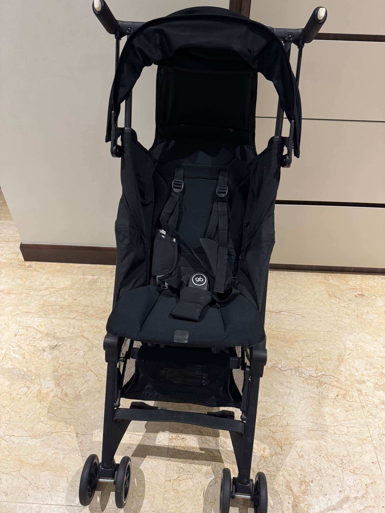 Preloved GB Pockit+ Black stroller with canopy harness and storage basket.