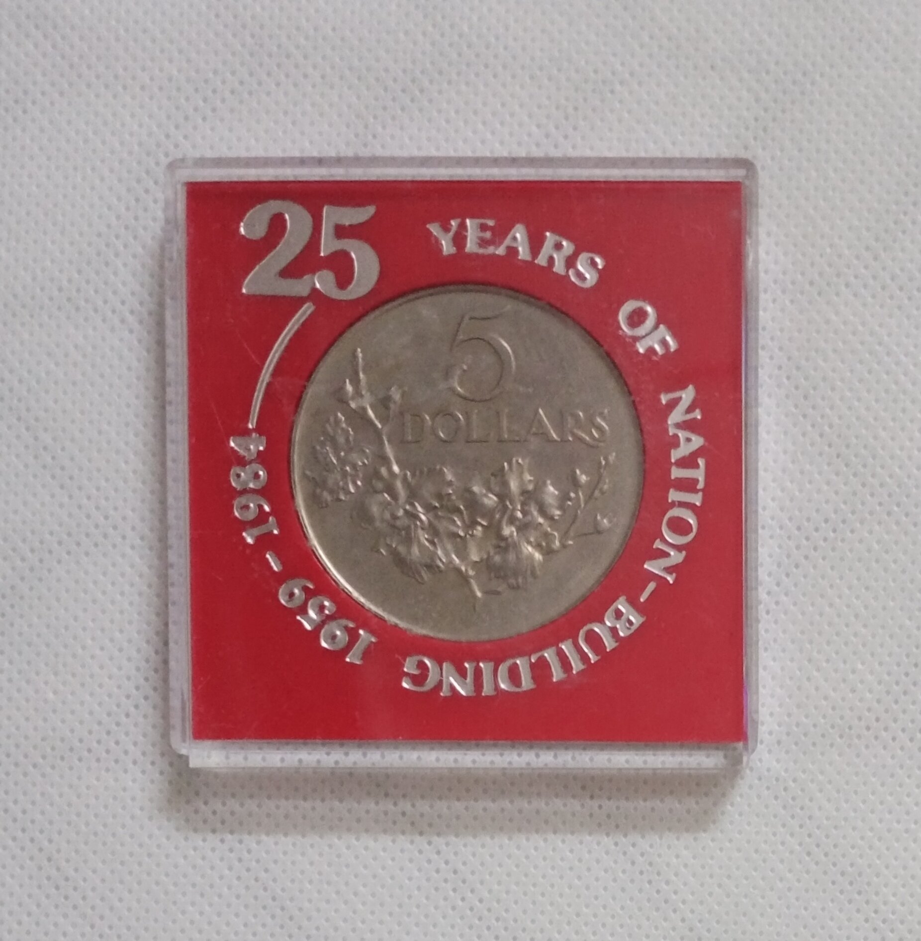 Commemorative 25 Years of Nation-Building” Singapore 5 dollars